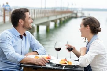 couple having a date at the restaurant overlooking a bridge