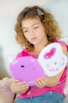 Young girl with electronic book