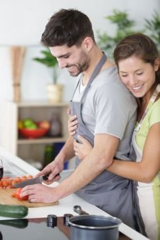 positive stylish trendy sweet married people cooking together