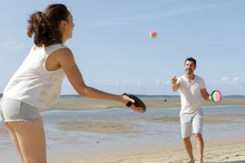 a happy couple playing beach game