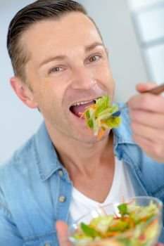 Man eating a healthy salad