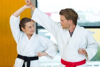 portrait of couple doing karate