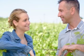 two winegrowers in the vines
