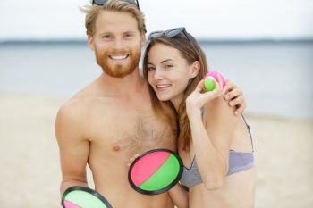 a couple playing beach game