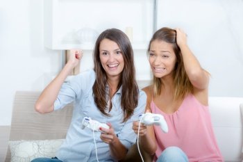 2 women playing video games