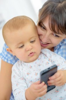 a baby is on smartphone