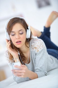 young woman checking her playlist