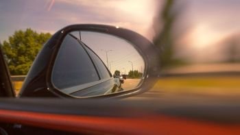 Looking through the mirror, street racers view, transportation backgrounds