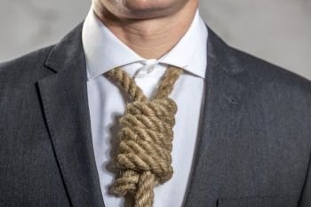 Midsection of businessman with noose at office