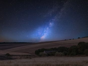 Stunning vibrant Milky Way composite image over landscape of English countryside 