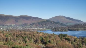 Stunning late afternoon Autumn Fall landscape image of the view from Catbells near Derwent Water in the Lake District towards Blencathra and Skiddaw peaks