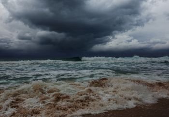 storm clouds and dramatic waves in ocean