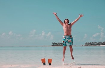 Happy Man  in the tropical beach. Travel and emotion concept