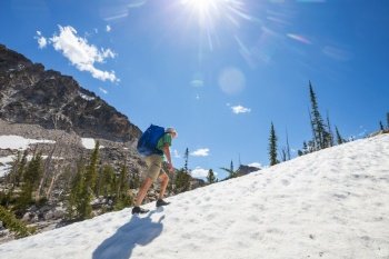 The climb in snowy mountains in the summer season
