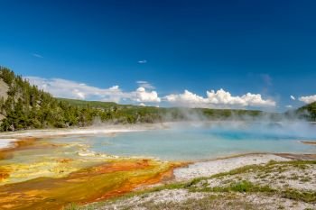 Hot thermal spring Excelsior Geyser Crater near Grand Prismatic Spring in Yellowstone National Park, Wyoming, USA