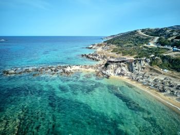 Beautiful beach and rocky coastline top aerial view drone shot, Sithonia, Greece