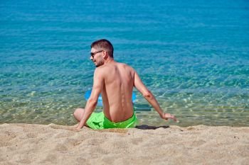 Man on beach in Greece 