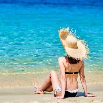 Woman in bikini on beach, Sithonia, Greece