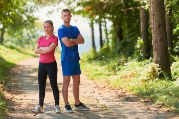 a portrait of a young couple preparing for a morning run and morning exercise