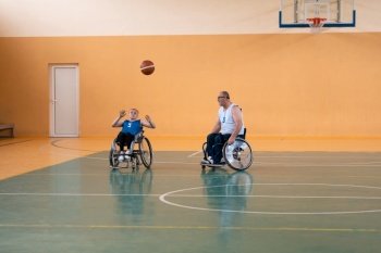 a young woman playing wheelchair basketball in a professional team. Gender equality, the concept of sports with disabilities. High quality photo. a young woman playing wheelchair basketball in a professional team. Gender equality, the concept of sports with disabilities. 