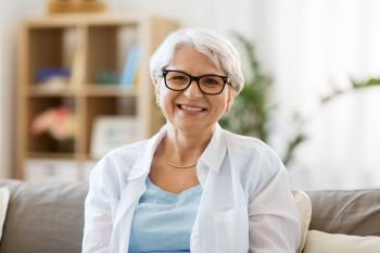 vision, age and people concept - portrait of happy senior woman in glasses. portrait of happy senior woman in glasses