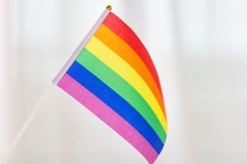 gay pride, homosexual and lgbt concept - close up of rainbow flag. close up of gay pride rainbow flag