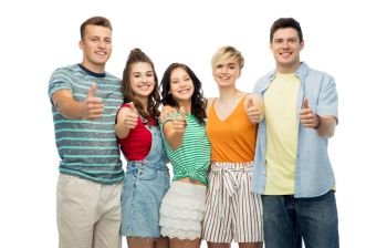 friendship and people concept - group of happy smiling friends hugging over white background showing thumbs up. happy friends showing thumbs up and hugging