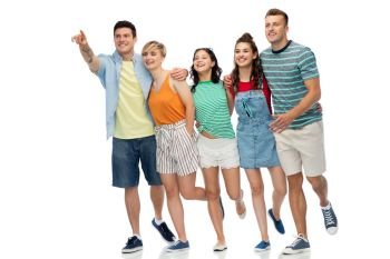 friendship and people concept - group of happy smiling friends running to something over white background. friends running to something over white background