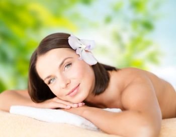 wellness, spa and beauty concept - close up of beautiful woman over green natural background. close up of beautiful woman at spa