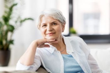 mature age and people concept - portrait of happy senior woman at home. portrait of happy senior woman at home