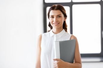 business, people and corporate concept - businesswoman or realtor with folder at office. businesswoman or realtor with folder at office