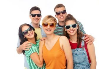 friendship, summer and people concept - group of happy smiling friends in sunglasses hugging over white background. friends in sunglasses over white background