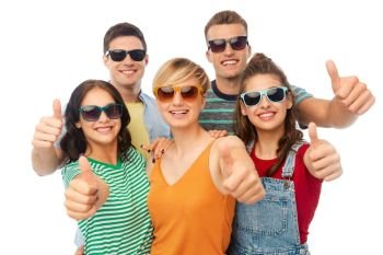 friendship, summer and people concept - group of happy smiling friends in sunglasses showing thumbs up over white background. happy friends showing thumbs up