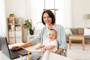 multi-tasking, freelance and motherhood concept - working mother baby boy and laptop computer at home office. working mother with baby boy and laptop at home