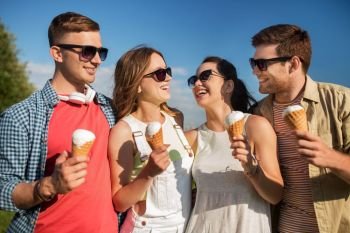 friendship, leisure and people concept - group of smiling friends with ice cream outdoors in summer. group of smiling friends with ice cream outdoors