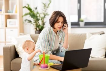 multi-tasking, freelance and motherhood concept - working mother with baby son calling on smartphone at home. working mother with baby calling on smartphone
