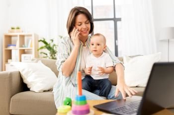 multi-tasking, freelance and motherhood concept - working mother with baby son calling on smartphone at home. working mother with baby calling on smartphone