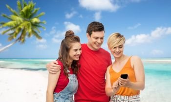 travel, tourism and technology concept - group of happy smiling friends with smartphone over exotic tropical beach background. friends with smartphone over beach background