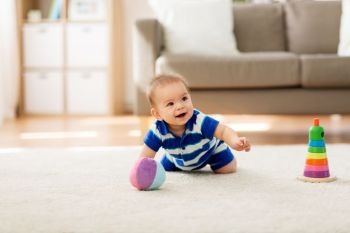 childhood and people concept - sweet little asian baby boy with toys at home. sweet little asian baby boy with toys at home