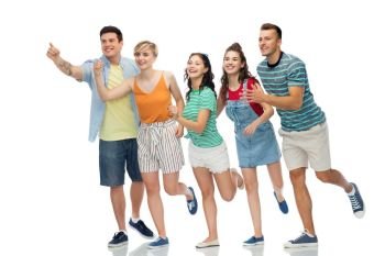 friendship and people concept - group of happy smiling friends running to something over white background. friends running to something over white background