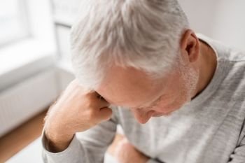 old age, problem and fail concept - close up of sad senior man thinking. close up of sad senior man thinking