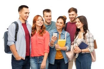 education, high school and technology concept - group of smiling students with books and smartphone over white background. group of smiling students with smartphone