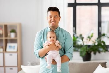 family, parenthood and fatherhood concept - middle aged father with little baby daughter at home. middle aged father with baby daughter at home