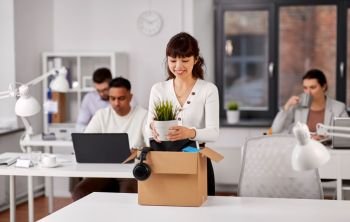 business, new job and corporate concept - happy smiling asian businesswoman or female employee with her personal stuff at office. happy employee with personal stuff at office