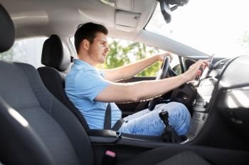 transport, vehicle and people concept - man or driver driving car and using gps navigator. man or driver driving car and using gps navigator