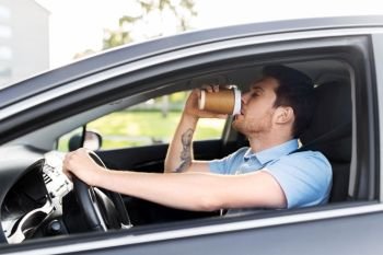 transport, vehicle and driving concept - tired sleepy man or car driver with takeaway coffee cup. tired man driving car and drinking coffee