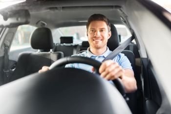transport, vehicle and people concept - smiling man or driver driving car. smiling man or driver driving car