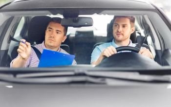 driver courses, exam and people concept - young man and driving school instructor with clipboard in car. car driving school instructor and young driver
