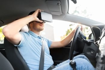 virtual reality, technology and driving concept - man or driver wearing vr glasses in car. man or driver wearing vr glasses and driving car