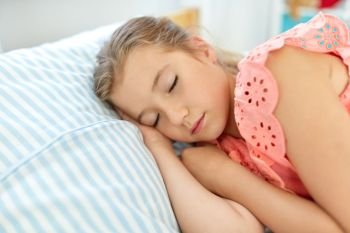 people, childhood and rest concept - little girl sleeping during day in her room at home. little girl sleeping in her room at home